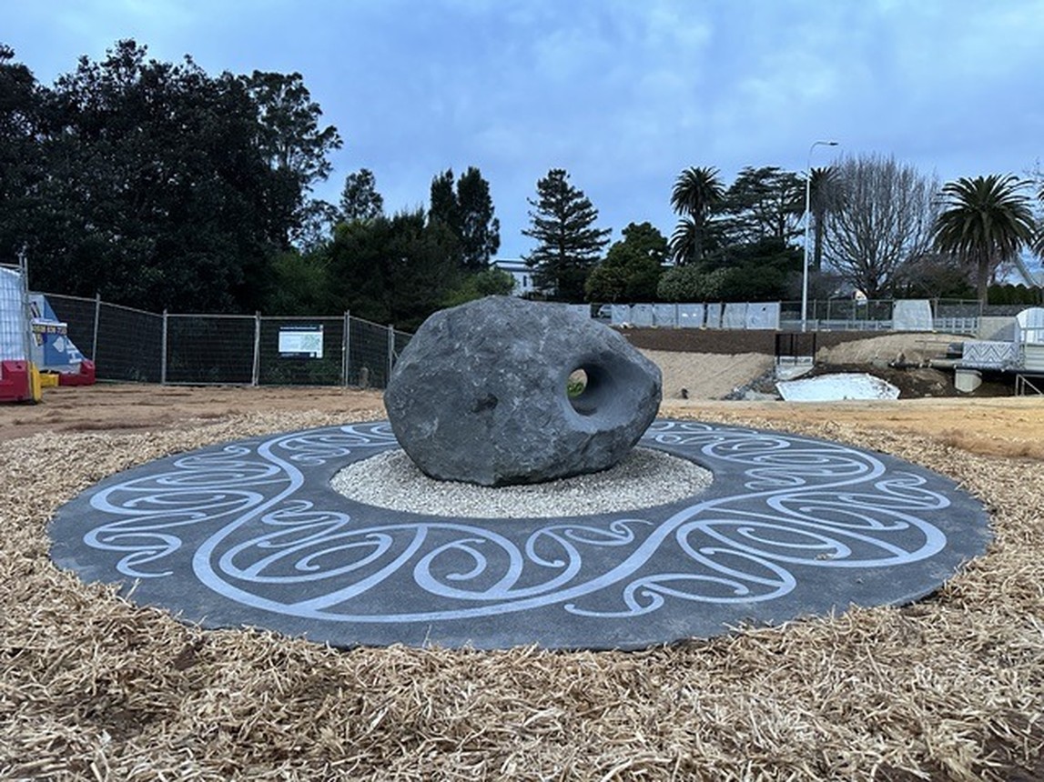 Ground Currents seen wide: the stone centred on its full circular concrete disc